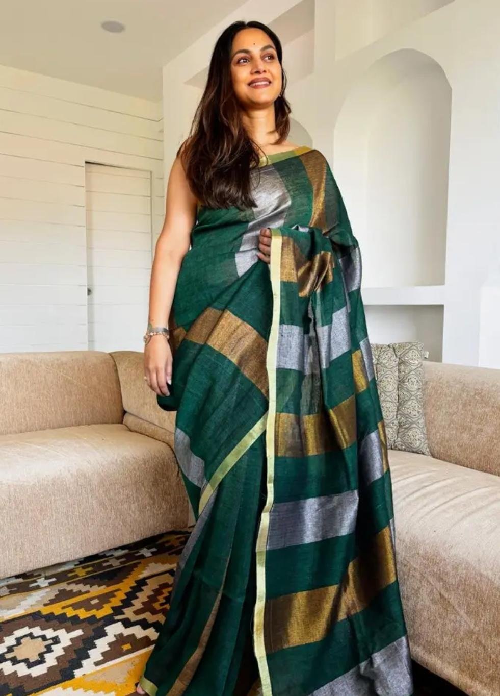 Color: Emerald Green Saree In A Modern Living Room