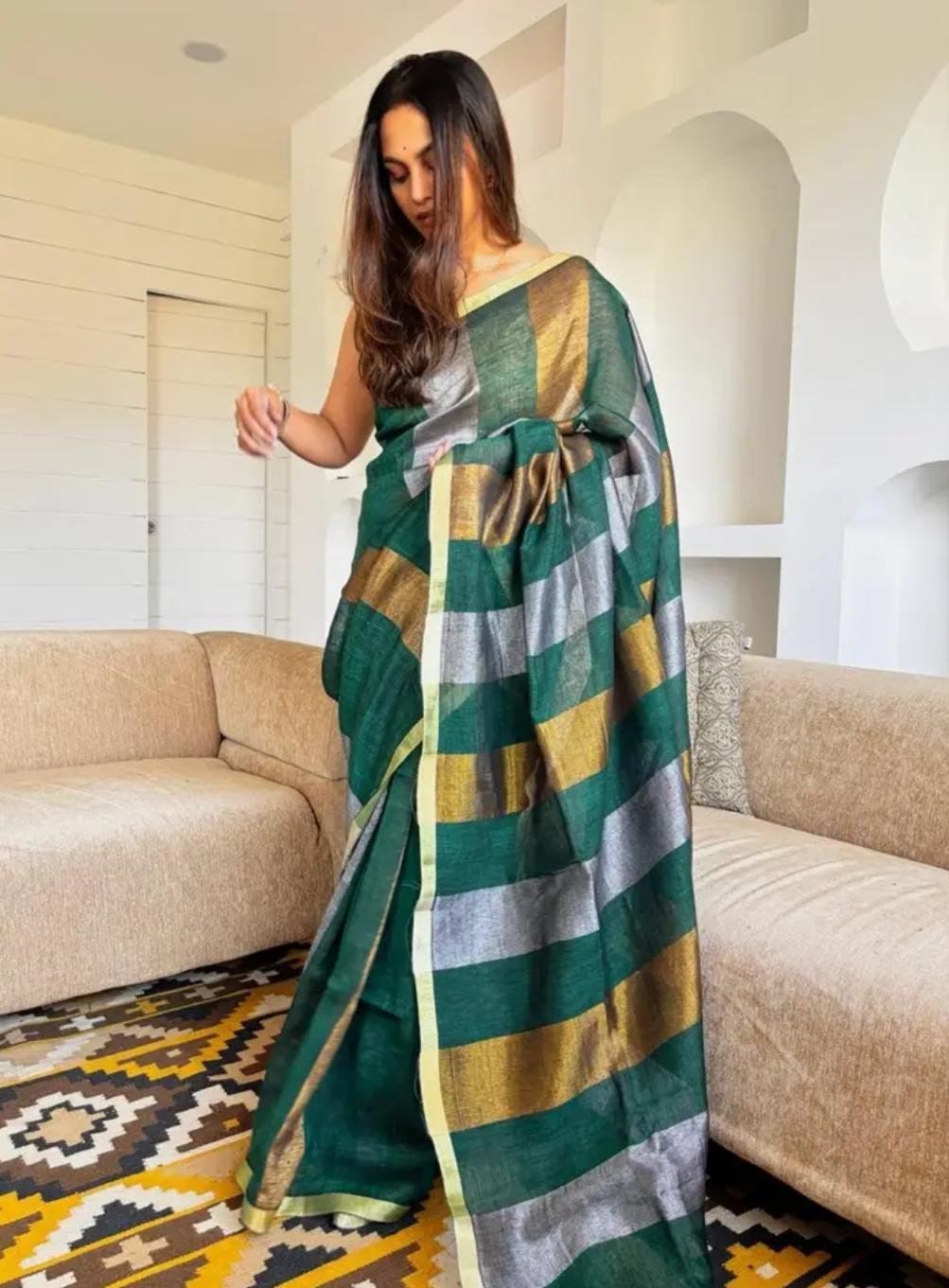 Color: Emerald Green Saree In A Modern Living Room